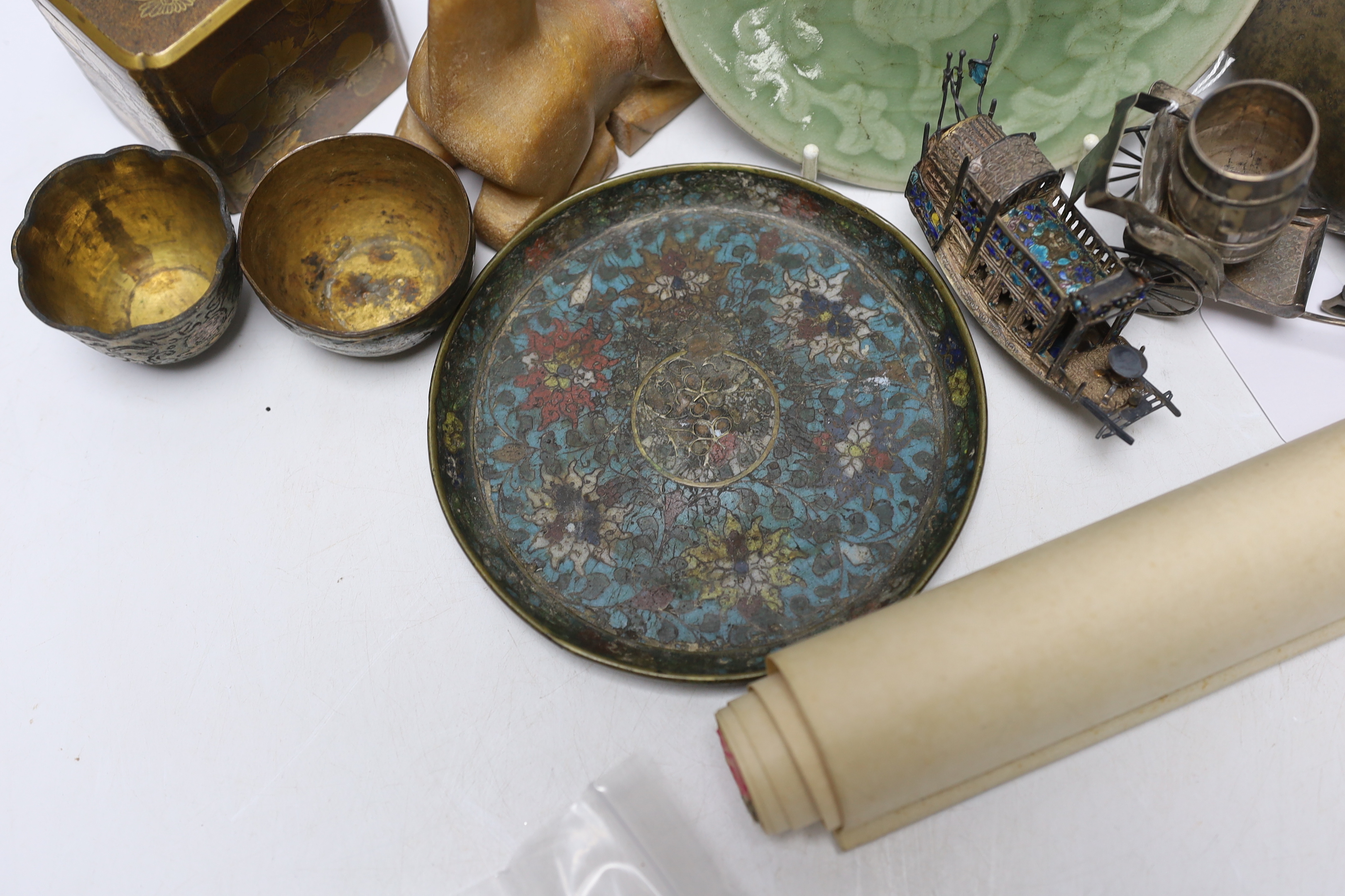 A Japanese lacquer three tier box and enamelled white metal miniature junk, gaming counters and sundries